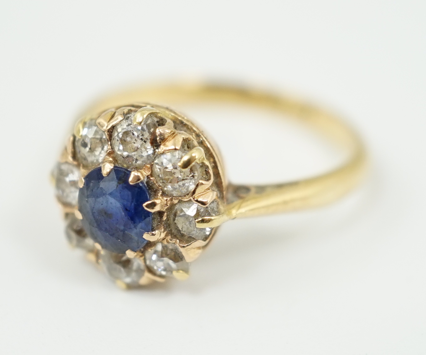 An 18ct gold, sapphire and diamond cluster ring